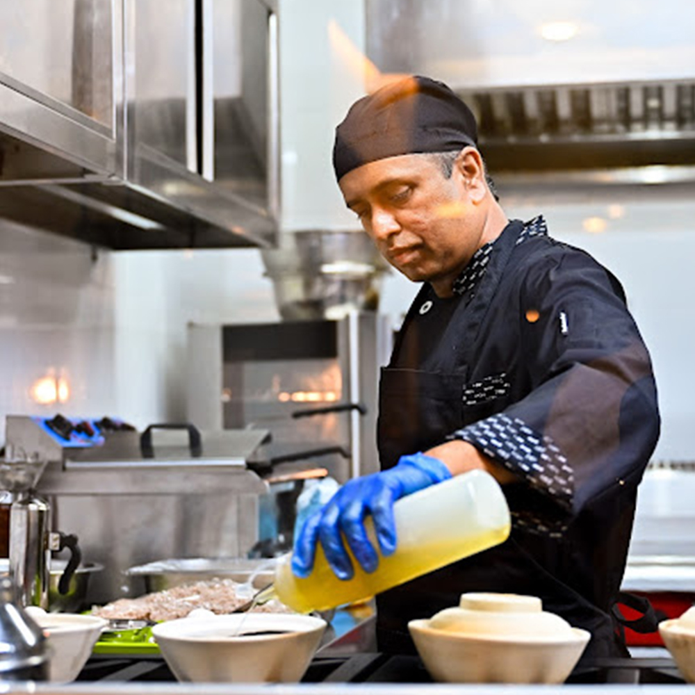 the view of the commercial kitchen through clear glass panes